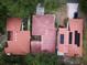 Aerial view showcasing the red tile roofs, solar panels, and well-maintained landscaping of the property at 1053 W Pebble Beach Cir, Winter Springs, FL 32708
