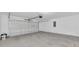 Spacious two-car garage with a white garage door at 1206 Beechdale Ct, Deltona, FL 32725
