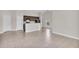 Open-concept living area showcasing tile flooring and natural light with views into the kitchen and dining area at 1206 Beechdale Ct, Deltona, FL 32725