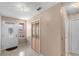 Bright entryway featuring tiled floors, decorative door, and stained glass closet door at 1312 Azalea Way, Winter Garden, FL 34787