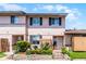 Charming two-story townhome with a well-maintained front yard and garden at 1312 Azalea Way, Winter Garden, FL 34787