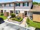 Townhome features manicured garden with stone border, walkway and private entrance at 1312 Azalea Way, Winter Garden, FL 34787