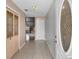 Welcoming foyer with tiled flooring, decorative closet, and an elegant front door at 1312 Azalea Way, Winter Garden, FL 34787