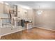 Bright living room featuring hardwood floors, chandelier lighting, and open staircase at 1312 Azalea Way, Winter Garden, FL 34787