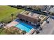 Aerial view of a large community pool with adjacent recreational facilities and green space at 1312 Azalea Way, Winter Garden, FL 34787