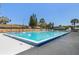 A community in-ground pool has a full fence and surrounding area for residents at 1312 Azalea Way, Winter Garden, FL 34787
