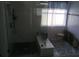 Modern bathroom featuring sleek glass enclosed shower and patterned tile flooring at 13200 Mallard Cove Blvd, Orlando, FL 32837