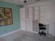 Bedroom with built-in shelving, desk and neutral walls at 13200 Mallard Cove Blvd, Orlando, FL 32837