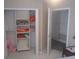 Bedroom closet with shelving for blankets, pillows, and a pink stuffed animal at 13200 Mallard Cove Blvd, Orlando, FL 32837