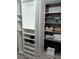 Organized closet with shelving for shoes, folded clothes, and overhead storage at 13200 Mallard Cove Blvd, Orlando, FL 32837