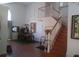 Stunning entryway with staircase, tall ceilings, and beautiful hardwood floors at 13200 Mallard Cove Blvd, Orlando, FL 32837