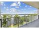 Enjoy amazing views of the lake and blue skies from this cozy balcony at 13427 Blue Heron Beach Dr # 404, Orlando, FL 32821