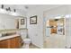 Bright bathroom featuring a granite vanity and decorative lighting fixtures at 13427 Blue Heron Beach Dr # 404, Orlando, FL 32821