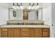 Bathroom features double sinks, granite counters, and walk in shower at 13427 Blue Heron Beach Dr # 404, Orlando, FL 32821