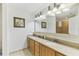 Bathroom features double sinks, granite counters, and walk in shower at 13427 Blue Heron Beach Dr # 404, Orlando, FL 32821