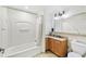 Clean bathroom featuring a shower and tub, a granite-topped vanity, and tile flooring at 13427 Blue Heron Beach Dr # 404, Orlando, FL 32821