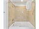 Bathroom showcasing a soaking tub with tiled surround at 13427 Blue Heron Beach Dr # 404, Orlando, FL 32821