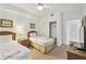 Light-filled bedroom featuring two twin beds, wooden furniture and ceiling fan with closet access at 13427 Blue Heron Beach Dr # 404, Orlando, FL 32821