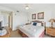 The main bedroom features a queen bed, soft carpet, and access to a walk-in closet at 13427 Blue Heron Beach Dr # 404, Orlando, FL 32821