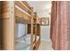 A close-up of a bunk bed showing its top and bottom bunks and curtains at 13427 Blue Heron Beach Dr # 404, Orlando, FL 32821