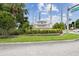 The entrance to the Blue Heron community showcases lush landscaping and a prominent sign, creating a welcoming feel at 13427 Blue Heron Beach Dr # 404, Orlando, FL 32821
