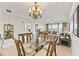 Formal dining area with views of living room and outdoor landscape at 13427 Blue Heron Beach Dr # 404, Orlando, FL 32821