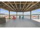 Inside the covered gazebo, complete with comfortable seating, overlooking the lake and adjacent to the pier at 13427 Blue Heron Beach Dr # 404, Orlando, FL 32821