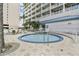 Cozy hot tub area with comfortable seating, set against the backdrop of lush tropical landscaping and condos at 13427 Blue Heron Beach Dr # 404, Orlando, FL 32821