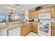 Modern kitchen with breakfast bar open to the dining and living areas at 13427 Blue Heron Beach Dr # 404, Orlando, FL 32821
