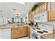 Open kitchen overlooking the living space and beautiful water views at 13427 Blue Heron Beach Dr # 404, Orlando, FL 32821