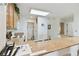 Bright kitchen with island bar top and appliances at 13427 Blue Heron Beach Dr # 404, Orlando, FL 32821