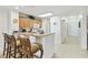 Kitchen island with breakfast bar seating and views of the hallway at 13427 Blue Heron Beach Dr # 404, Orlando, FL 32821