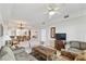 Open-concept living room featuring tile floors, neutral walls, and plenty of space for entertaining at 13427 Blue Heron Beach Dr # 404, Orlando, FL 32821