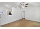 Bright living room featuring tile floors, high ceilings, and open layout at 1447 Candlewyck Dr, Orlando, FL 32807