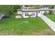 Aerial view of the backyard shows a well-maintained lawn and white privacy fence at 1511 E Horatio Ave, Maitland, FL 32751