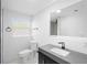Modern bathroom features a floating vanity, sleek fixtures, and an illuminated mirror at 1511 E Horatio Ave, Maitland, FL 32751