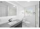 Bathroom featuring sleek vanity, modern fixtures, and marble details at 1511 E Horatio Ave, Maitland, FL 32751