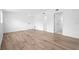 Spacious bedroom with wood-look tile flooring and a light, airy atmosphere at 1511 E Horatio Ave, Maitland, FL 32751