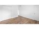 Bedroom with wood-look tile flooring and closet at 1511 E Horatio Ave, Maitland, FL 32751