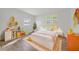 ' bedroom showcases playful decor, a cozy bed, and ample toy storage at 1511 E Horatio Ave, Maitland, FL 32751