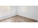 Bedroom with wood-look tile flooring and bright natural light at 1511 E Horatio Ave, Maitland, FL 32751