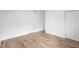 Unfurnished bedroom boasts sleek tile flooring and ample closet space at 1511 E Horatio Ave, Maitland, FL 32751