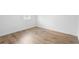 Bedroom with wood-look tile flooring and bright natural light at 1511 E Horatio Ave, Maitland, FL 32751