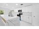 Modern kitchen featuring white cabinets, quartz countertops, and stainless steel appliances at 1511 E Horatio Ave, Maitland, FL 32751
