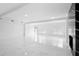 Bright living room with marble floors, recessed lighting, and expansive windows at 1511 E Horatio Ave, Maitland, FL 32751