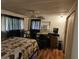 View of bedroom features including a ceiling fan, desk, and an AC unit at 1525 Hilltop Rd, Casselberry, FL 32707