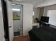 Comfortable bedroom featuring a full bathroom, vanity, and TV, providing a private and functional space at 1525 Hilltop Rd, Casselberry, FL 32707