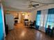 Bright living room featuring an open floor plan with kitchen and dining area, creating a welcoming and functional living space at 1525 Hilltop Rd, Casselberry, FL 32707