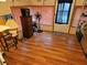 A view of a room showcasing wood-look flooring, neutral walls, and simple decor at 1525 Hilltop Rd, Casselberry, FL 32707