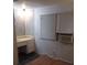 Corner vanity area with drawers and an air conditioning unit by the window at 1525 Hilltop Rd, Casselberry, FL 32707